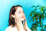 young beauty woman massaging her face